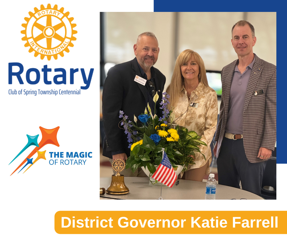 A group of people standing next to each other in front of a bouquet of flowers.