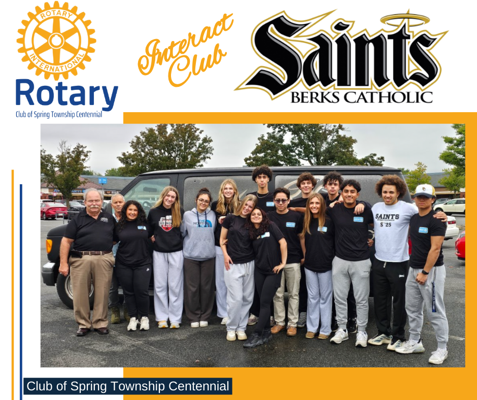A group of people are posing for a picture in front of a van sponsored by the saints berks catholic club