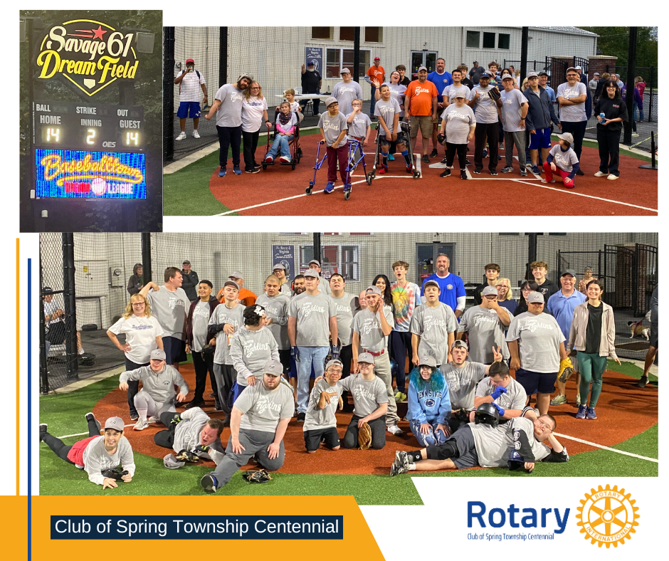 A group of people are posing for a picture on a baseball field.