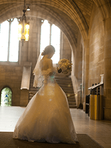 Side view photo of the bride wearing her wedding dress