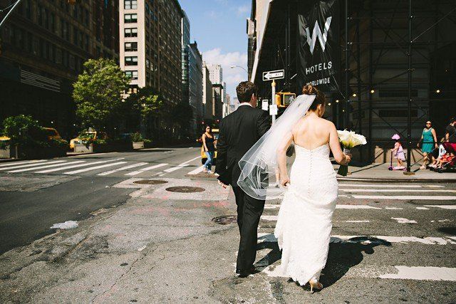 The bride and groom roaming in the city