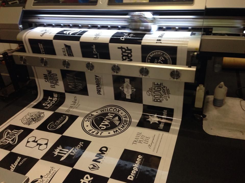 A black and white checkered style table cloth is being printed - Plastiglass Mid North Coast, NSW