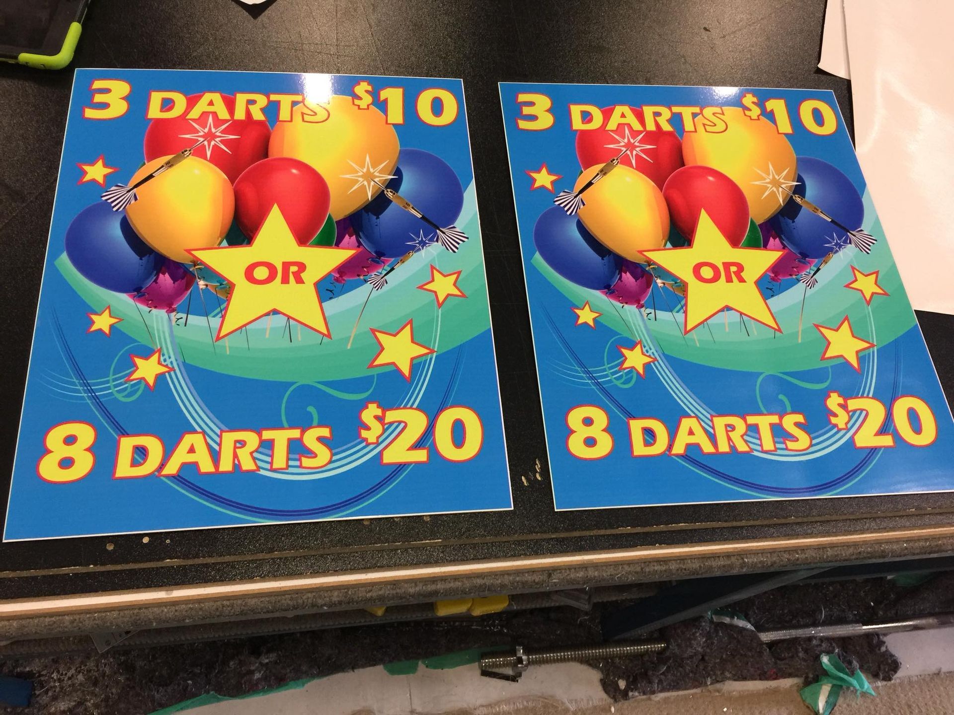Two posters that say 3 darts for $10 and 8 darts for $20 - Plastiglass Mid North Coast, NSW