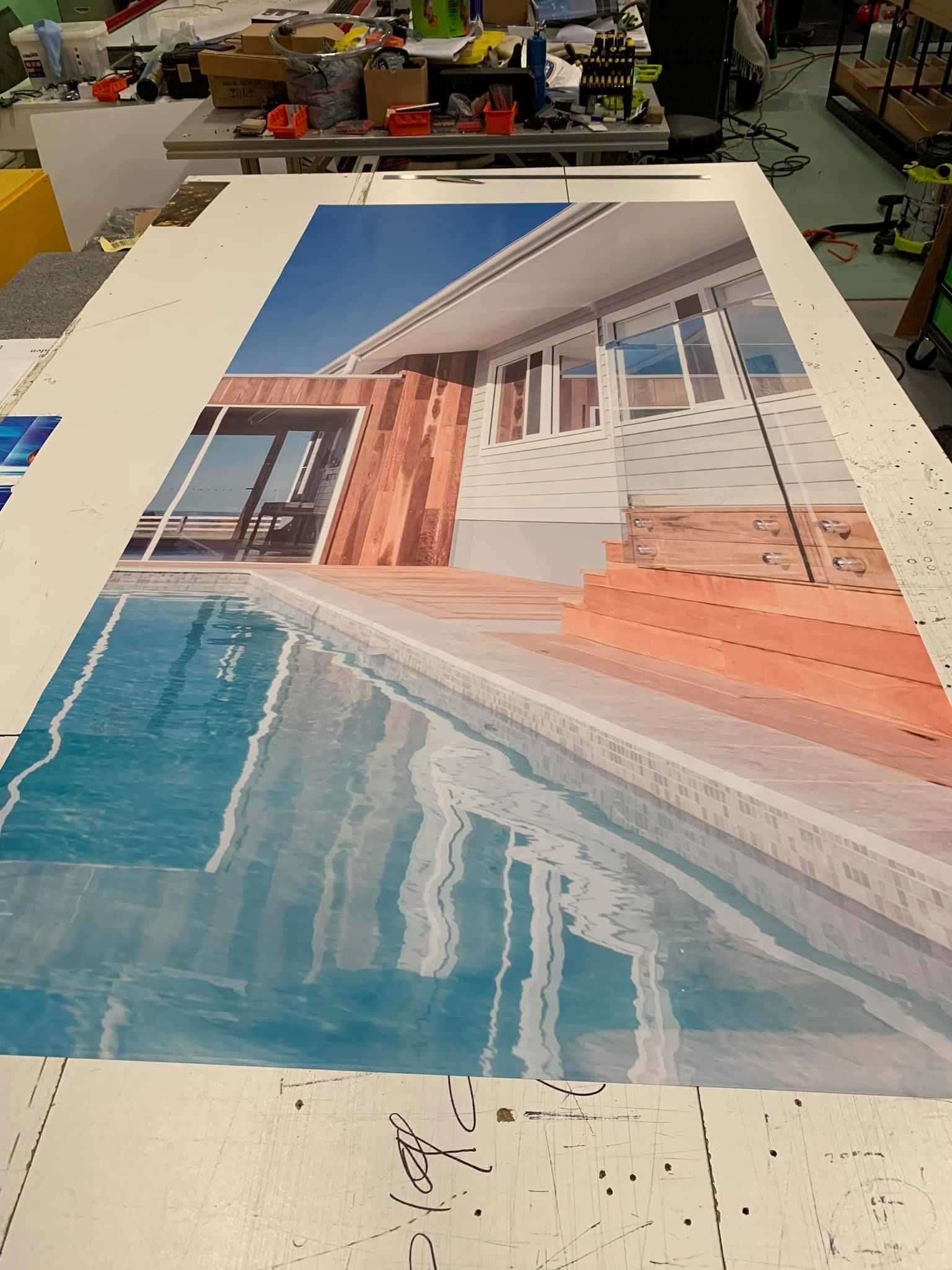 A large painting of a house and a pool is sitting on a table - Plastiglass Mid North Coast, NSW
