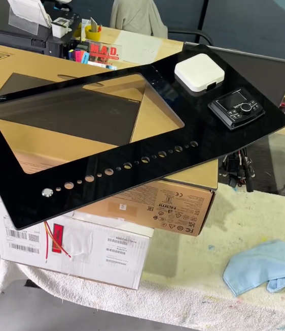 A piece of glass is sitting on a table next to a box - Plastiglass Mid North Coast, NSW