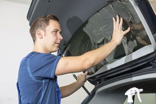 Technician Performing Window Tinting Service