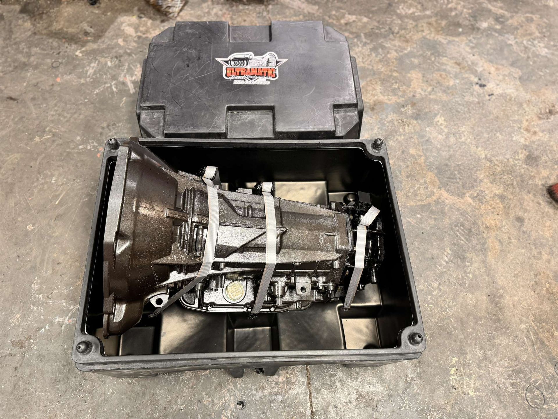 A black box with a gearbox inside of it.