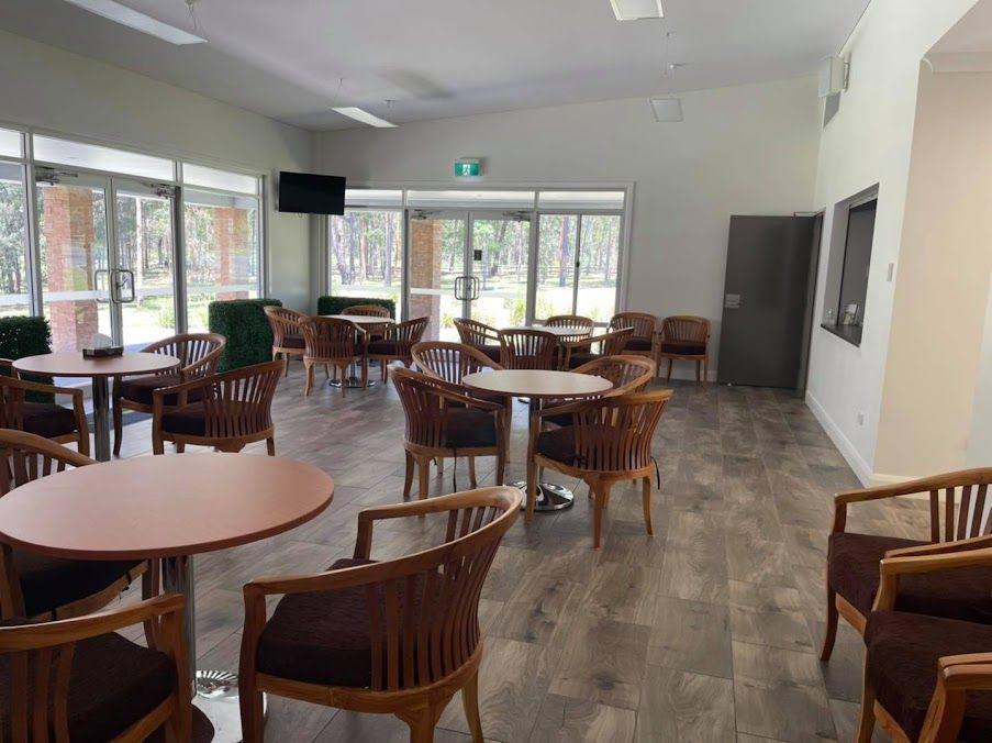There Are Many Tables And Chairs In The Room — United Funeral Care In South West Rocks, NSW