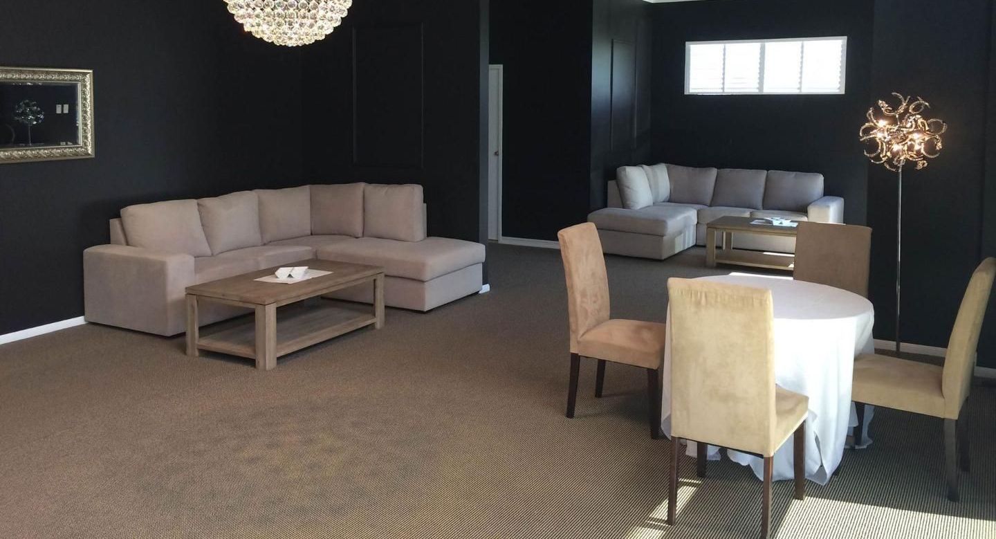 A Living Room With A Couch, Table And Chairs — United Funeral Care In Crescent Head, NSW