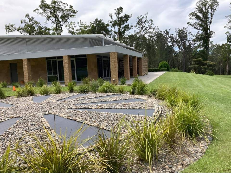 A Large Building With A Lot Of Windows And A Patio In Front Of It — United Funeral Care In Kempsey, NSW