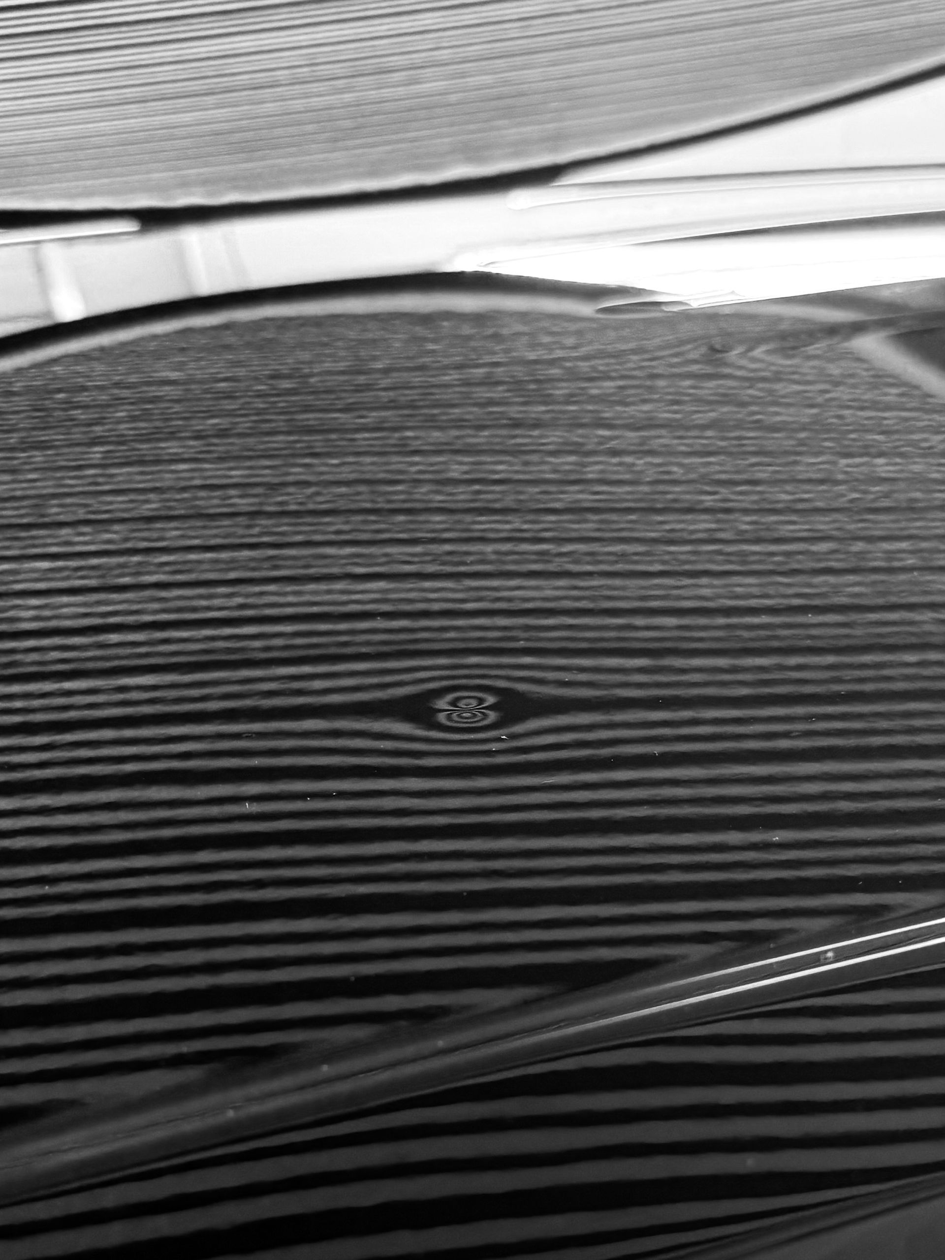 A black and white photo of a stack of records on a table.