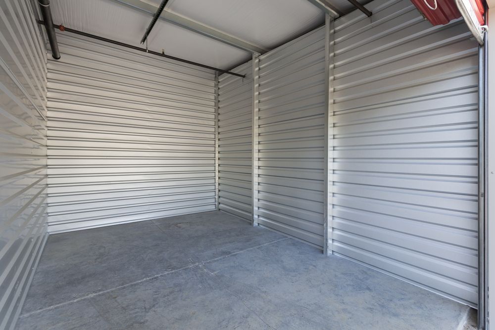 An Empty Storage Room With A Ladder In It — Howlett's Mini Storage In Bundaberg East, QLD