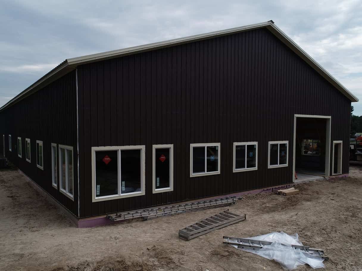 A newly finished pole barn by Red Beaver Construction.