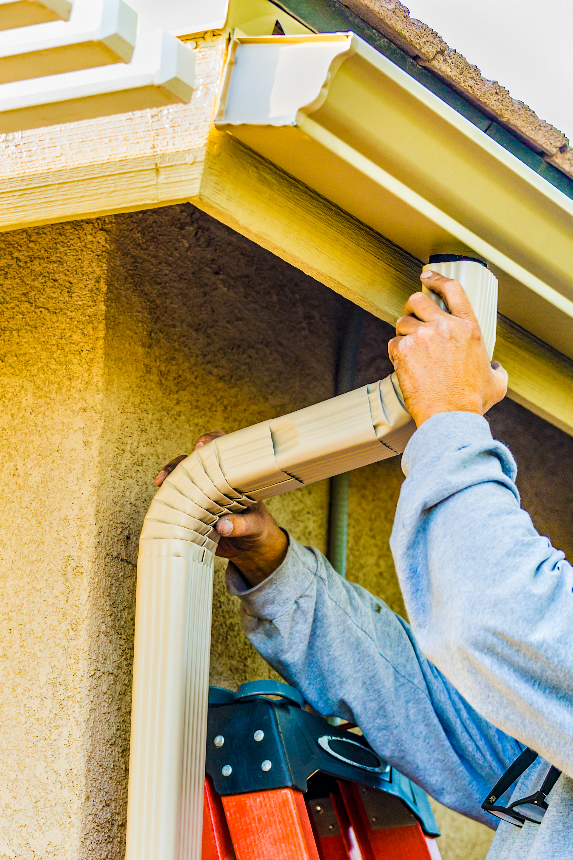 Close-up of seamless gutter system installed on a residential home by Red Beaver Construction.