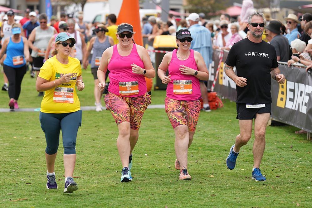 Group Three Women With One Men Running Together In The Race — Run Fest in Port Macquarie, NSW