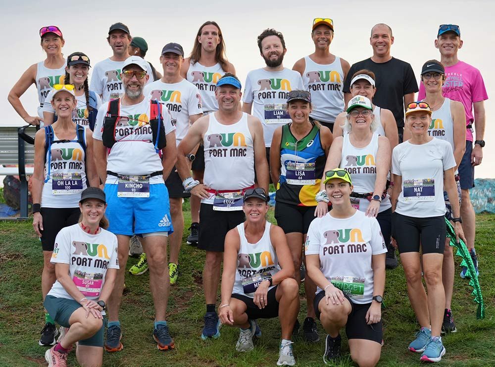 A Group Of Individuals Is Gathered In A Field For A Photo — Run Fest in Port Macquarie, NSW