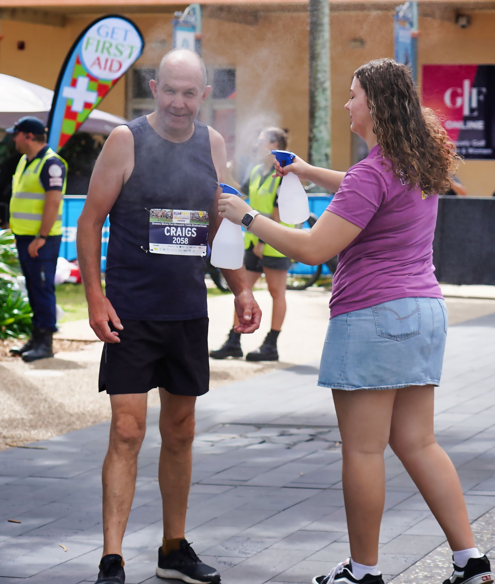 A Group Of People Are Running Down A Street — Run Fest in Port Macquarie, NSW
