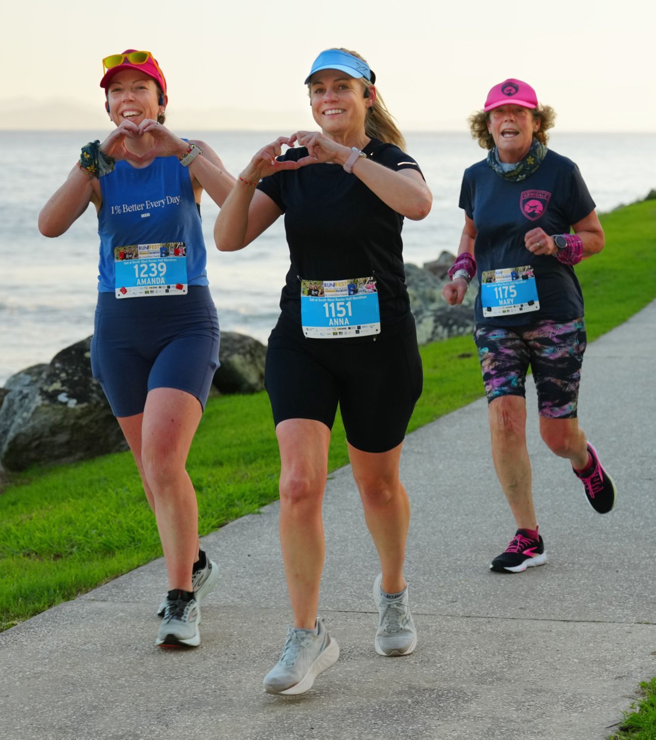 A Group Of People Are Standing Under A Tent At Night — Run Fest in South West Rocks, NSW