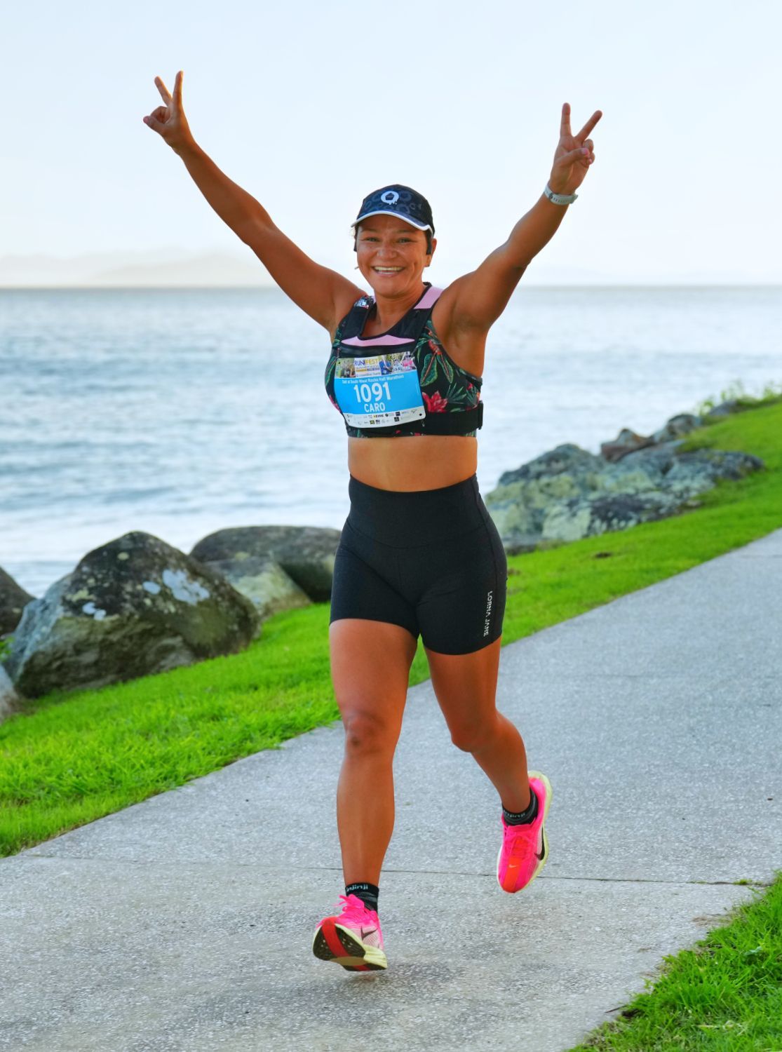 A Group Of People Are Posing For A Picture In An Event Information Room — Run Fest in South West Rocks, NSW