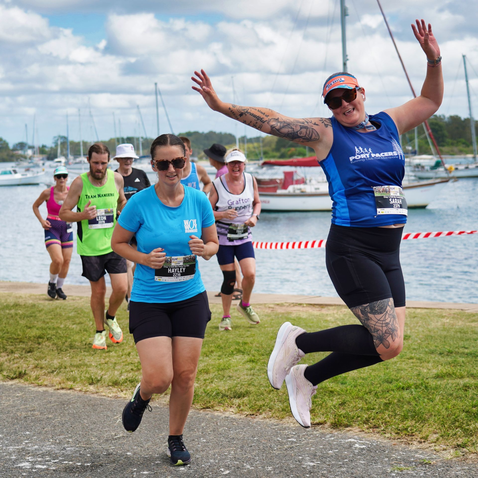 A Man And Woman Are Holding Hands With A Little Girl Wearing A Shirt That Says Eire — Run Fest in Port Macquarie, NSW