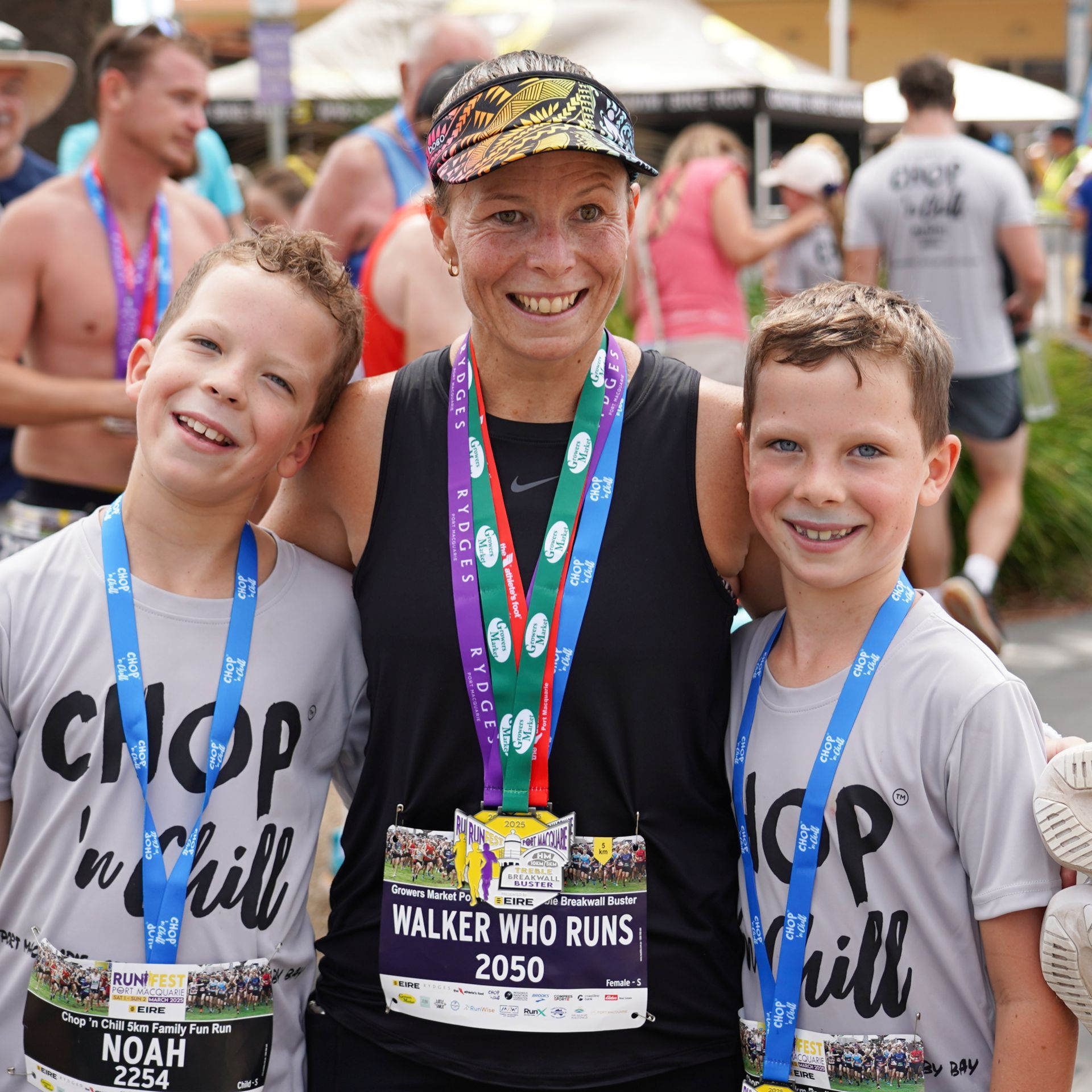 A woman is running a marathon on a beach with Heart Of Courage Tag — Run Fest in Port Macquarie, NSW