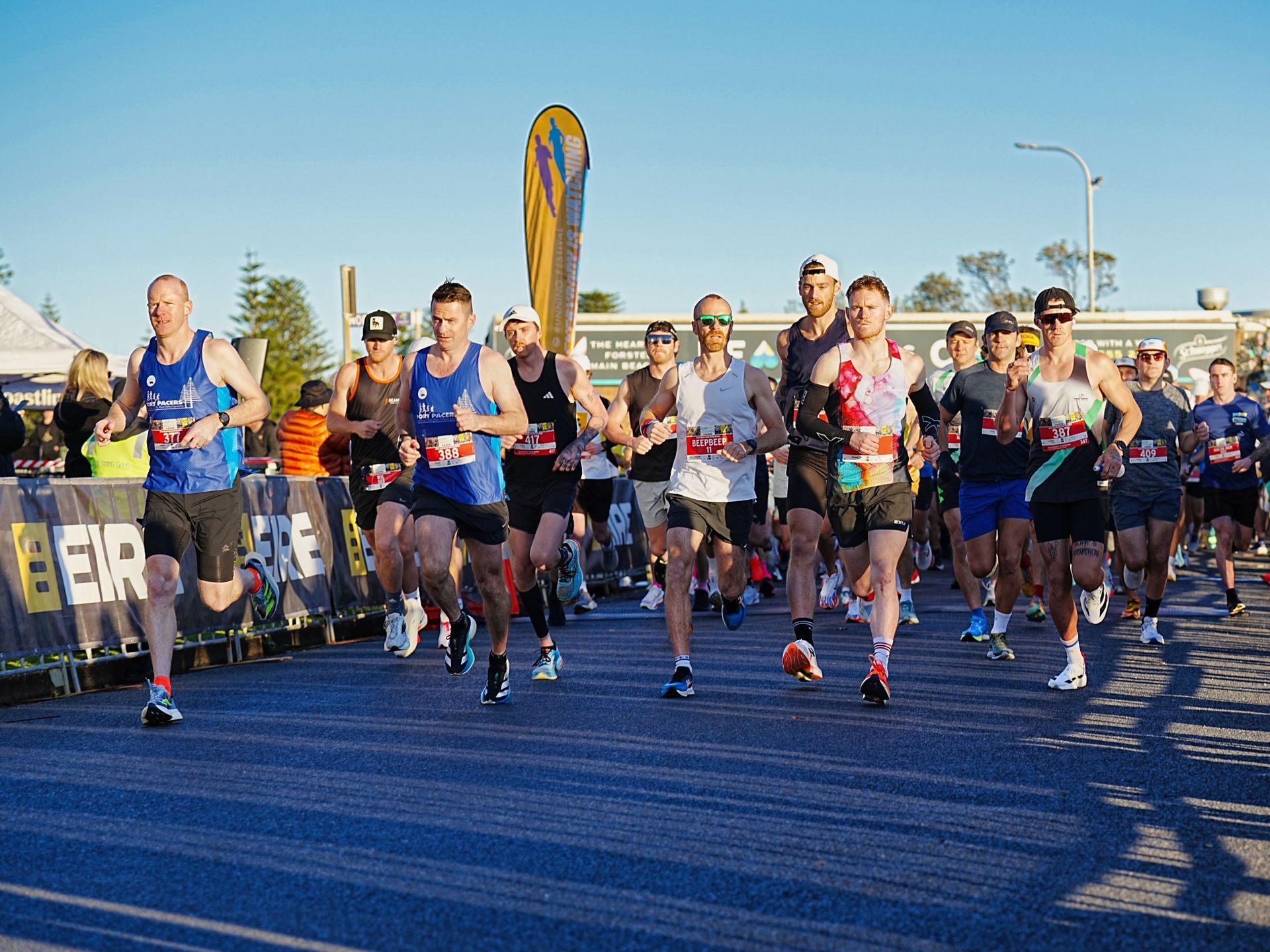 A Man Is Running Along The Pavement — Run Fest in Forster - Tuncurry, NSW