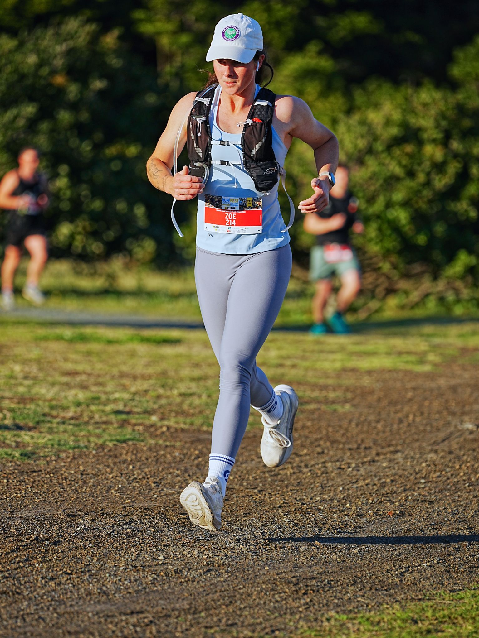A Man Wearing A Shirt That Says Achieve Your Impossible Is Running A Marathon — Run Fest in Forster - Tuncurry, NSW