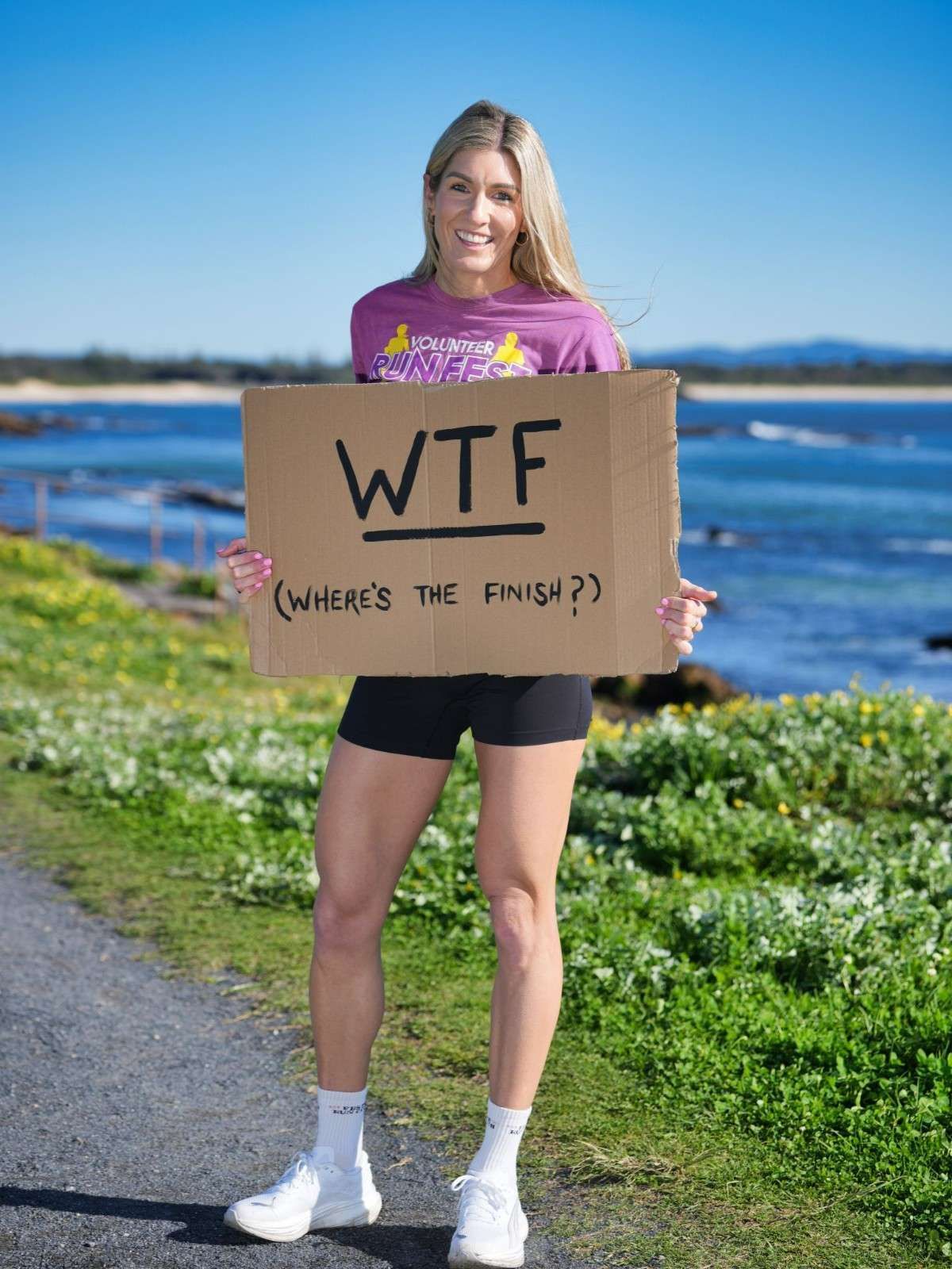 Woman Holding Sign Reading WTF Where's The Finish — Run Fest in Central Coast, NSW