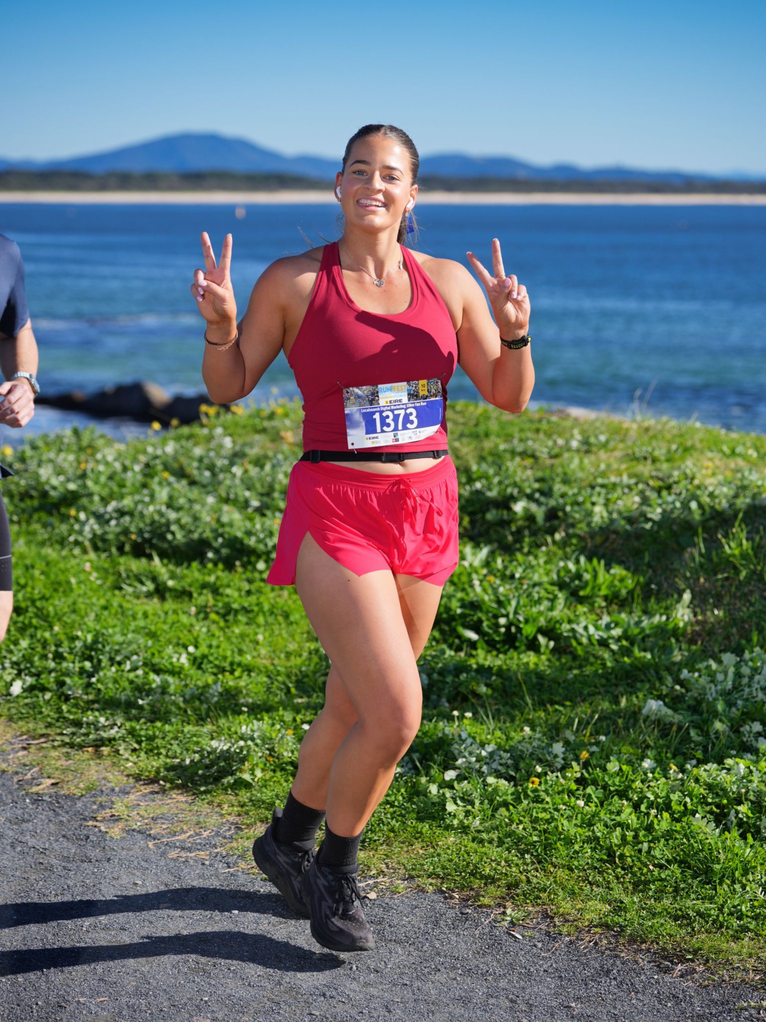 Two Women Are Walking Along A Path Next To A Body Of Water  — Run Fest in Forster - Tuncurry, NSW