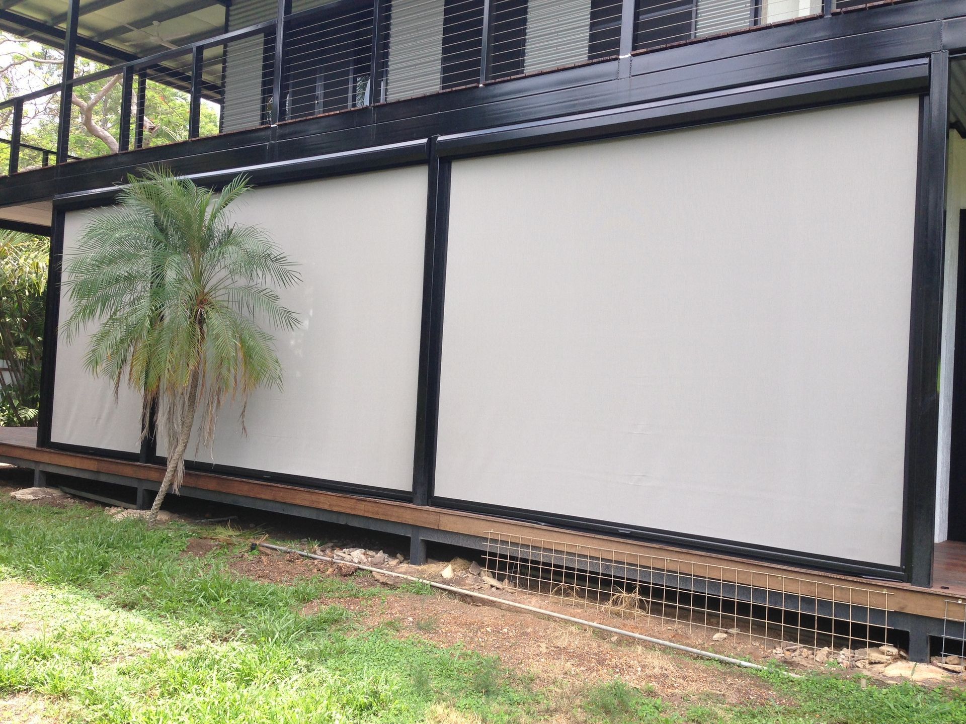 Black Roller Blinds Cover a Large Window — NT Blinds in Yarrawonga, NT