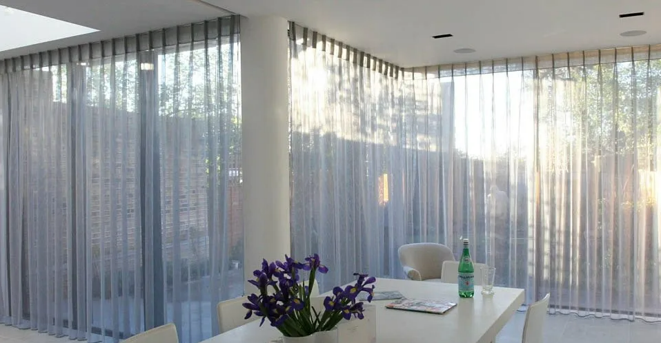 Bright Modern Dining Room With Sheer Curtains — NT Blinds in Yarrawonga, NT