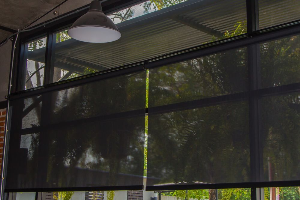 Black Roller Blinds Cover a Large Window — NT Blinds in Yarrawonga, NT
