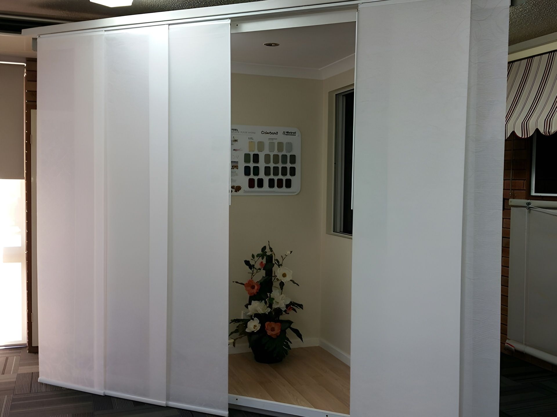 White Sliding Panel Blinds Covering a Room's Doorway — NT Blinds in Yarrawonga, NT