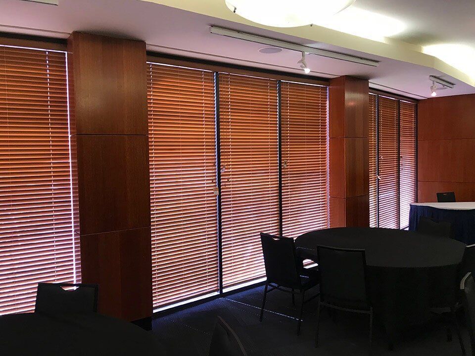 Meeting Room With Wood-paneled Walls and Blinds Covering Windows — NT Blinds in Yarrawonga, NT