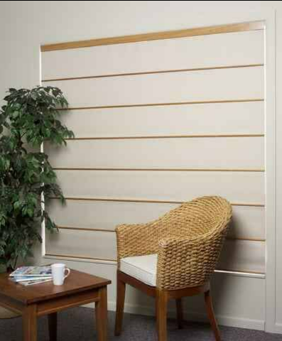 Wicker Chair Beside a Small Wooden Table in a Bright Room — NT Blinds in Yarrawonga, NT