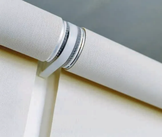 Close-up of a White Roller Blind With a Silver Metal Bracket — NT Blinds in Yarrawonga, NT