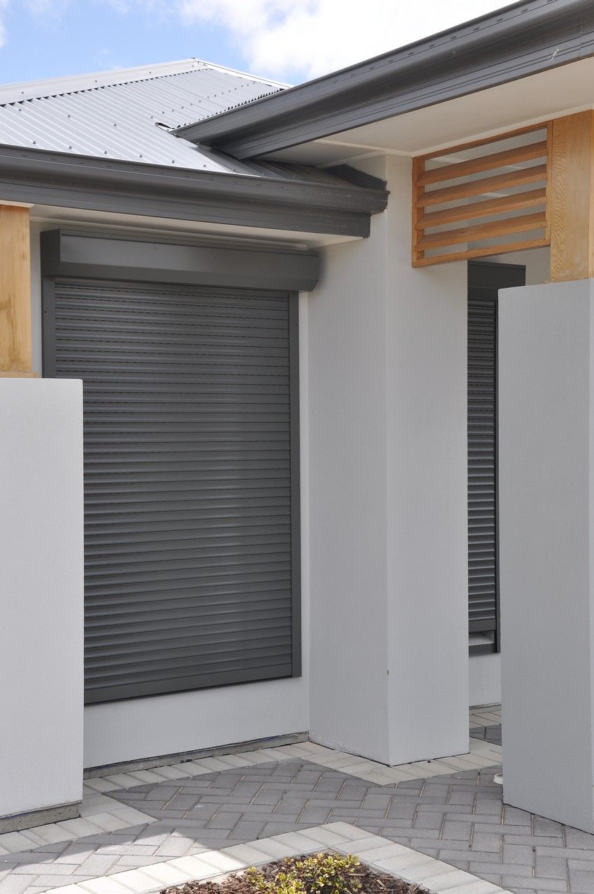 Three Windows With Closed, Dark Gray Roll-down Shutters — NT Blinds in Yarrawonga, NT