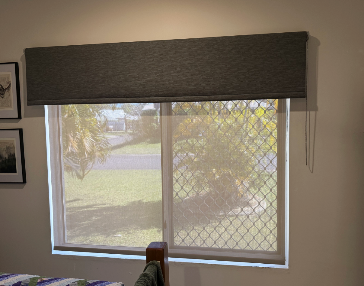 Window with a gray fabric valance and light-colored mesh blind, covering a window with a security screen  — NT Blinds in Fannie Bay, NT