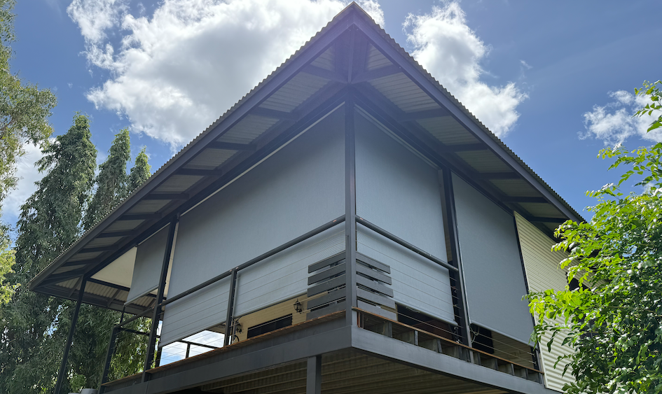 Black Awning Over Glass Doors of a Store — NT Blinds in Yarrawonga, NT
