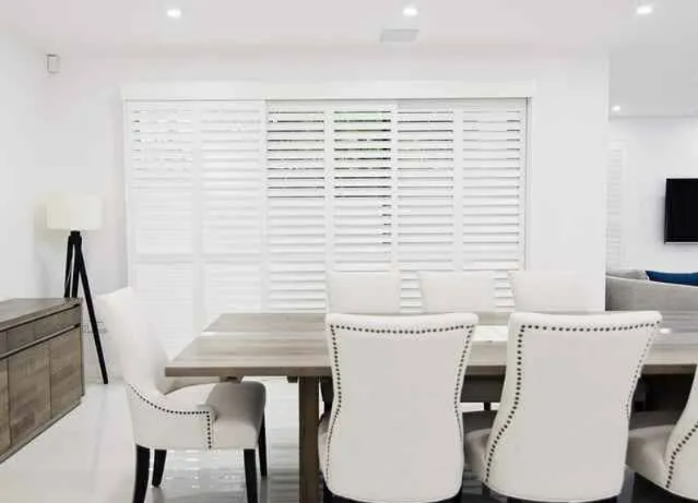 Bright Modern Dining Room With White Chairs — NT Blinds in Yarrawonga, NT