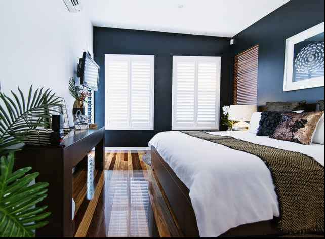 Modern Bedroom With Dark Walls, White Bedding — NT Blinds in Yarrawonga, NT
