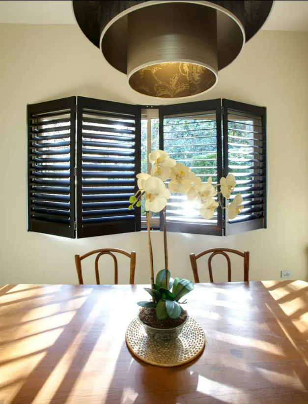 Dining Room With Sunlit Table, White Orchid Centerpiece — NT Blinds in Yarrawonga, NT
