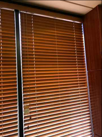 Closed Brown Window Blinds Covering a Window — NT Blinds in Yarrawonga, NT