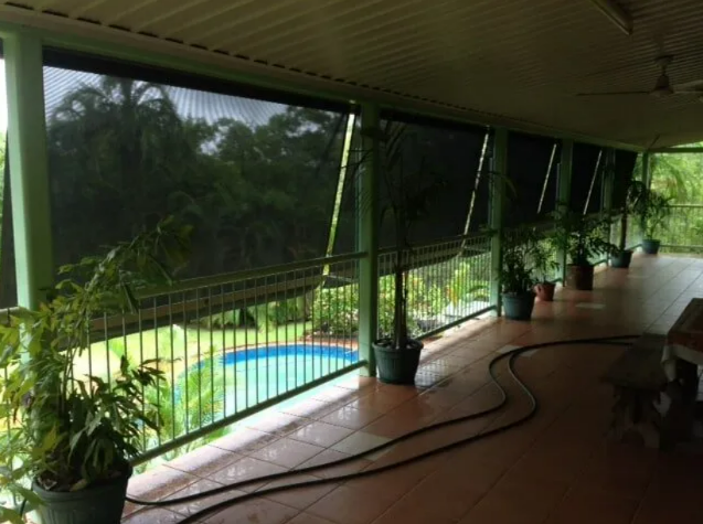 Covered Patio With Potted Plants Overlooking — NT Blinds in Yarrawonga, NT