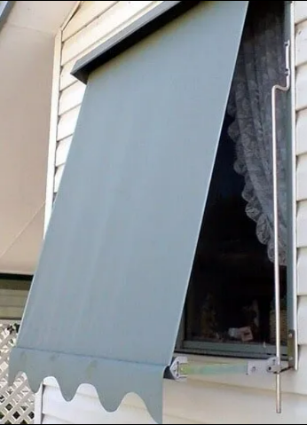 Blue Window Awning Extended Over an Open Window on a House Exterior — NT Blinds in Yarrawonga, NT