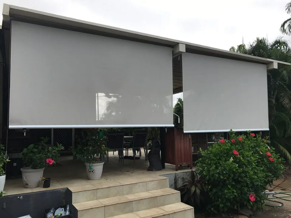 House With Two Gray Roll-down Shades Over a Porch — NT Blinds in Yarrawonga, NT