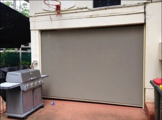 Closed Gray Garage Door Under a Basketball — NT Blinds in Yarrawonga, NT