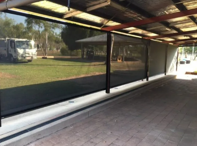 Covered Patio With Black Privacy Screens Overlooking a Grassy Yard — NT Blinds in Yarrawonga, NT