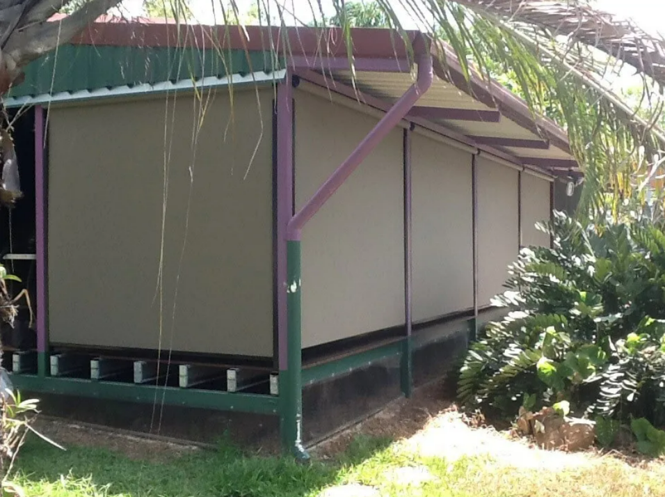 Small Green-and-tan Shed With a Slanted Roof — NT Blinds in Yarrawonga, NT