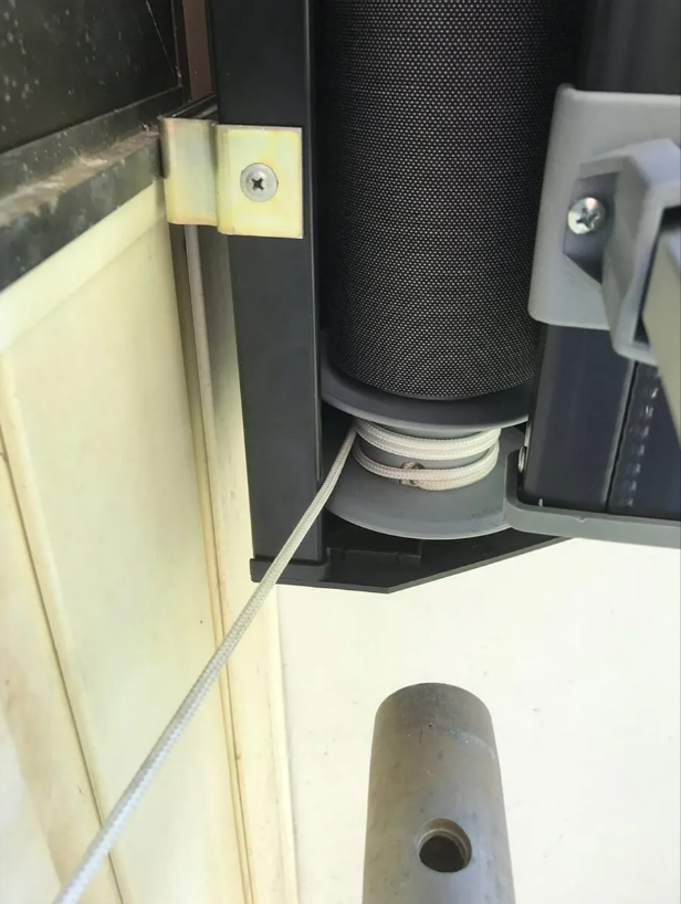 Close-up of a Black Cylindrical Mechanical Part Mounted — NT Blinds in Yarrawonga, NT